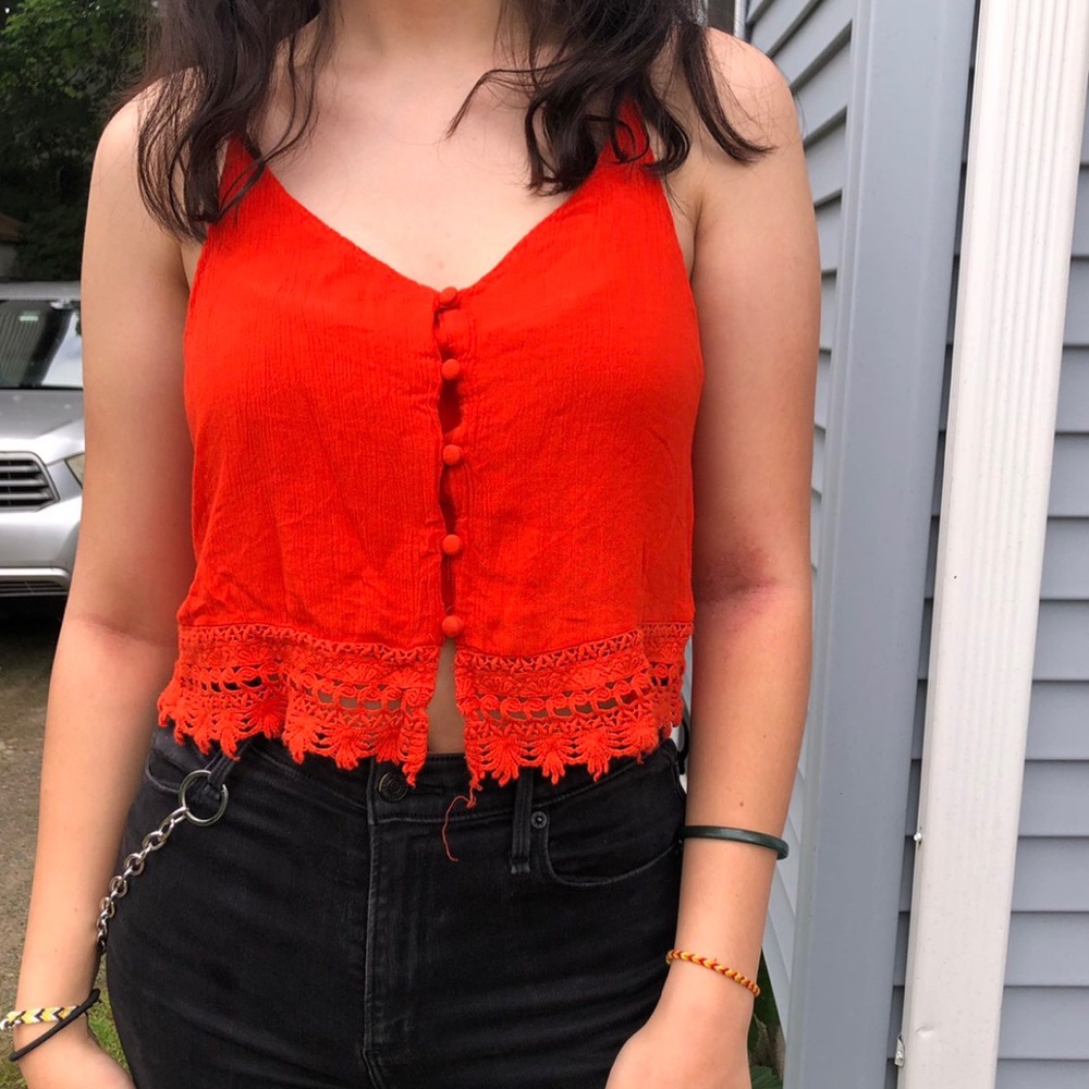 Cute orange-red loose cropped tank top.
